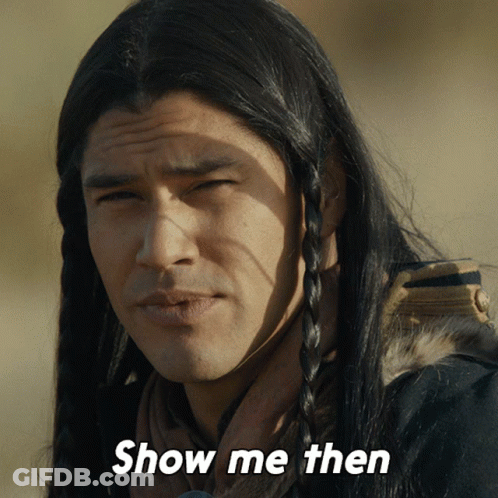 A Man With Long Hair Says Show Me Then In White Letters GIF