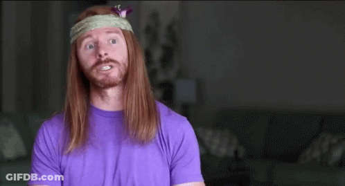 A Man With Long Hair Wearing A Headband And A Purple Shirt Says Stay Focused GIF