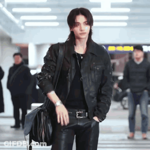 A Man With Long Hair Wearing A Leather Jacket GIF