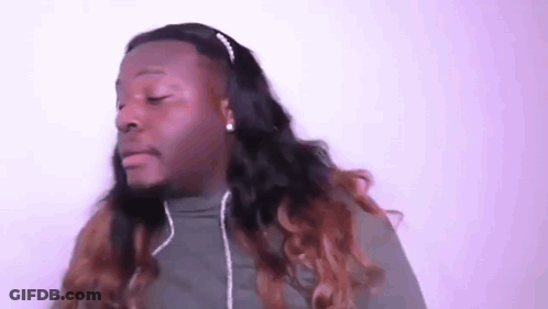A Man With Long Hair Wearing Headphones And A Headband . GIF