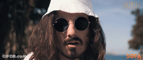A Man With Long Hair Wearing Sunglasses And A White Hat With The Word Janik On The Bottom GIF