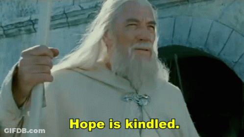 A Man With Long White Hair And A Beard Says Hope Is Kindled In Yellow Letters GIF