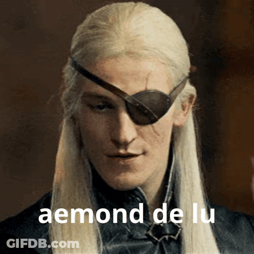 A Man With Long White Hair And A Patch On His Eye Has The Word Aemond De Lu On The Bottom GIF