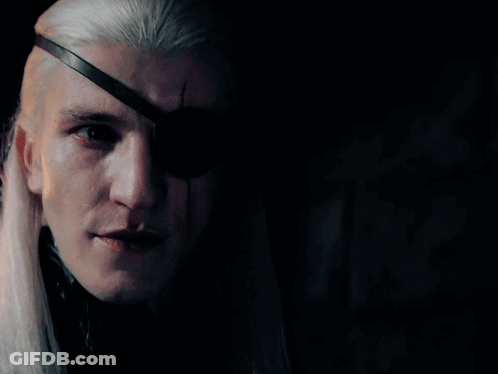 A Man With Long White Hair And An Eye Patch On His Eye GIF