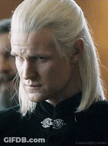 A Man With Long White Hair Has A Black Shirt On GIF
