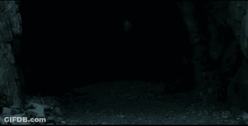 A Man With Long White Hair Is Holding A Sword In His Hand . GIF