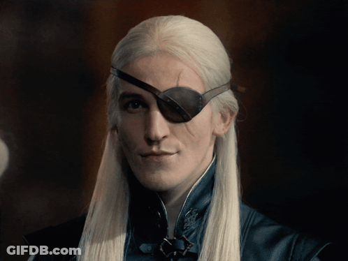 A Man With Long White Hair Wearing A Black Eye Patch GIF
