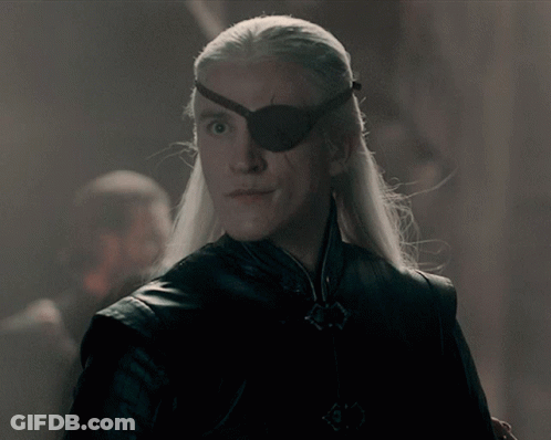 A Man With Long White Hair Wears A Black Eye Patch GIF
