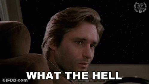 Man With Missing Teeth Sitting In Car Behind What The Hell GIF
