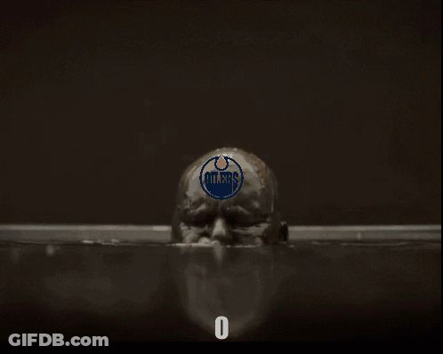 A Man With Oilers On His Head Is In A Bathtub GIF