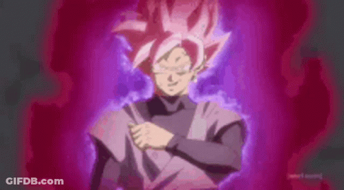 A Man With Pink Hair And A Black Shirt Is Standing In Front Of A Pink Background . GIF