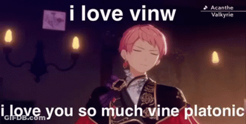 A Man With Pink Hair Is Standing In A Room With Candles And A Caption That Says `` I Love Vinw '' . GIF