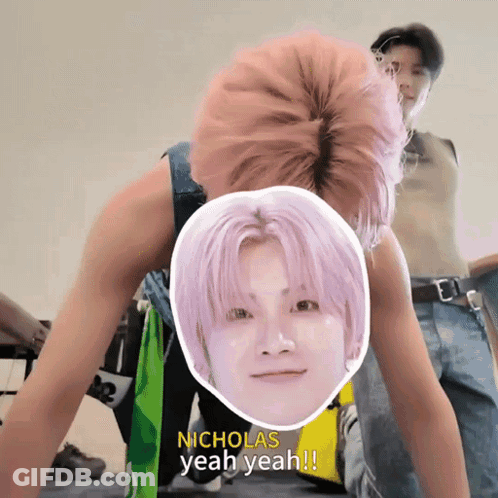 A Man With Pink Hair Says Nicholas Yeah Yeah In Front Of A Picture Of His Face GIF