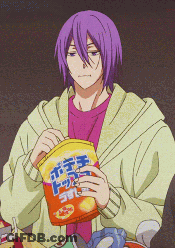 A Man With Purple Hair Is Holding A Bag Of Chips With Chinese Writing On It GIF