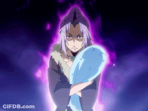 A Man With Purple Hair Is Holding A Blue Object In His Hands GIF