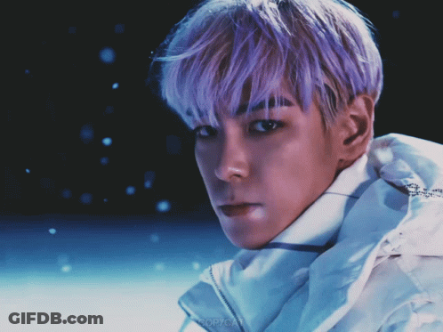 A Man With Purple Hair Is Wearing A White Jacket With The Word Copycat On It GIF