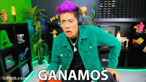A Man With Purple Hair Is Wearing Headphones And A Green Jacket With The Words Ganamos Written On It GIF