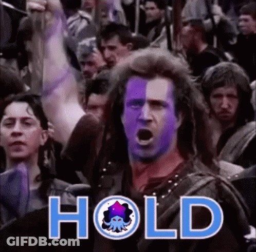 A Man With Purple Paint On His Face Is Standing In Front Of A Crowd With The Word Hold Written On The Bottom . GIF