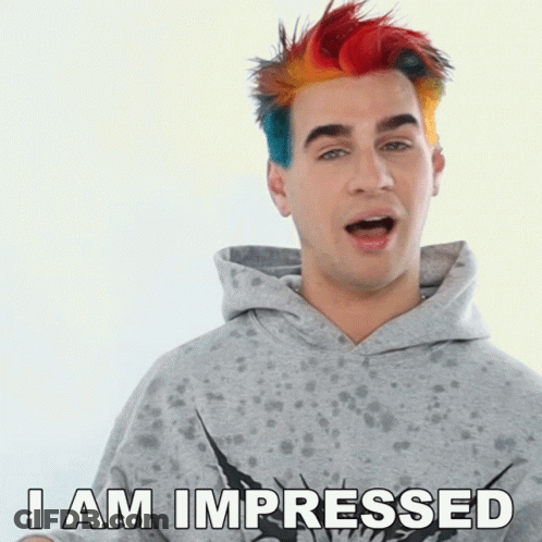 A Man With Rainbow Hair Says " I Am Impressed " GIF