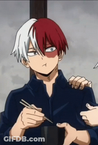 A Man With Red And White Hair Is Holding Chopsticks And Making A Face GIF