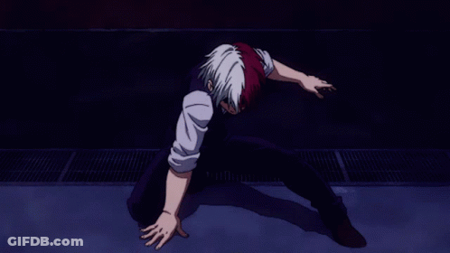 A Man With Red And White Hair Is Laying On The Ground GIF
