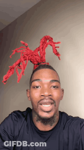 Man With Red Dreadlocks Smiling GIF
