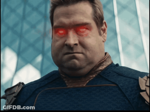 A Man With Red Eyes And A Blue Shirt GIF