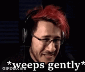 A Man With Red Hair And Glasses Is Wearing Headphones And Says `` Weeps Gently '' GIF