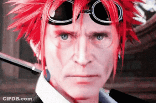 A Man With Red Hair And Goggles Looks At The Camera . GIF