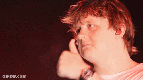A Man With Red Hair Giving A Thumbs Up Sign GIF