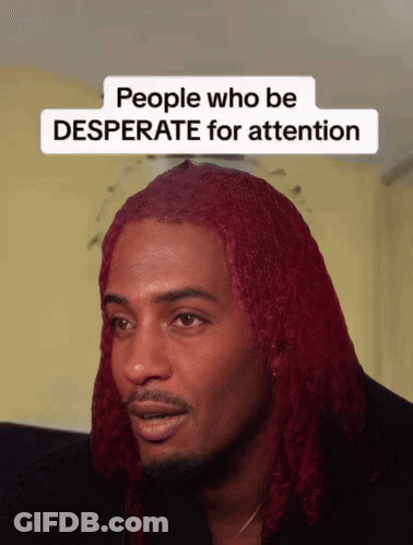 A Man With Red Hair Has A Sticker On His Face That Says People Who Be Desperate For Attention GIF