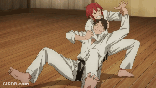 A Man With Red Hair Is Being Lifted By Another Man GIF