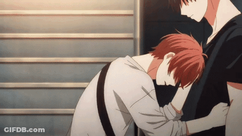 A Man With Red Hair Is Hugging Another Man 'S Arm GIF