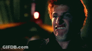 Red Haired Man Making Funny Face With Flashlight GIF