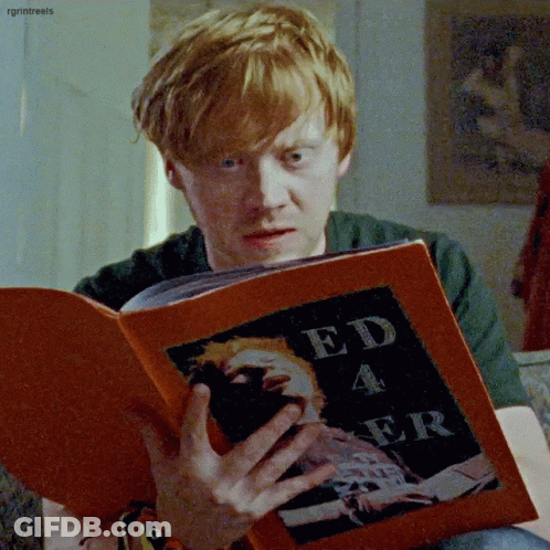 A Man With Red Hair Is Reading A Book Titled Ed 4 Er GIF