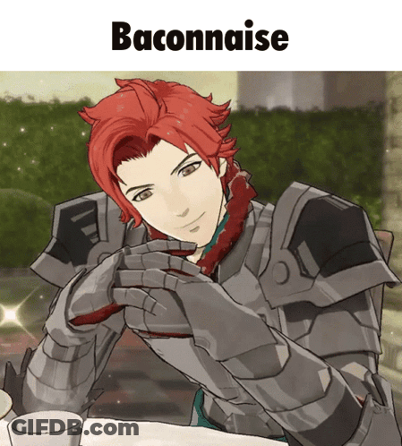A Man With Red Hair Is Sitting At A Table With A Cup Of Baconnaise In Front Of Him GIF