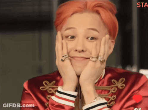 A Man With Red Hair Is Smiling With His Hands On His Face GIF
