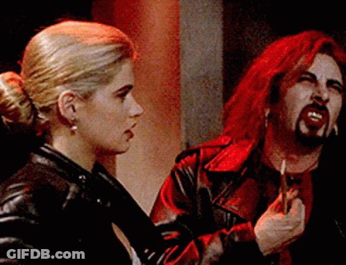 Red Haired Man Smoking Cigarette Watching Woman GIF