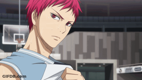 A Man With Red Hair Is Standing In Front Of A Basketball Court GIF