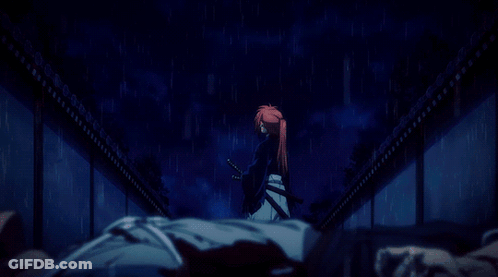 A Man With Red Hair Is Standing In The Rain With A Sword In His Hand GIF