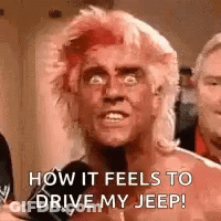A Man With Red Hair Is Talking About How It Feels To Drive His Jeep . GIF