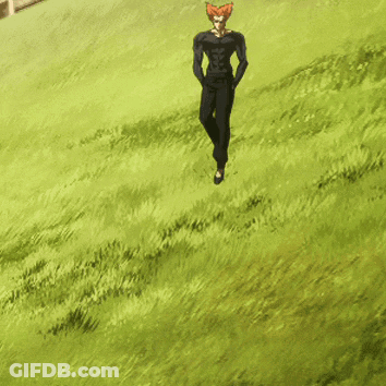 A Man With Red Hair Is Walking In A Field Of Grass GIF