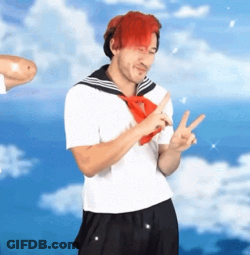 A Man With Red Hair Is Wearing A Sailor Suit And A Red Tie . GIF