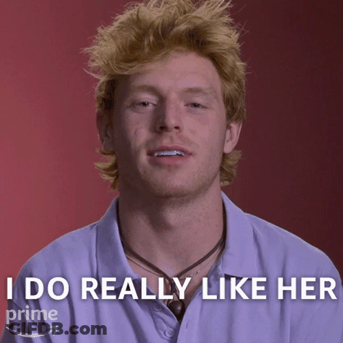 A Man With Red Hair Says " I Do Really Like Her " In Front Of A Red Background GIF