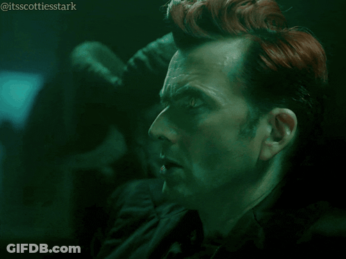 A Man With Red Hair Says Ooh How Mysterious In A Dark Room GIF