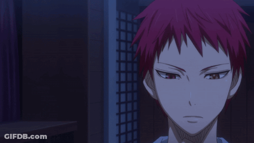 A Man With Red Hair Stands In A Dark Room With Another Man Holding A Basketball GIF