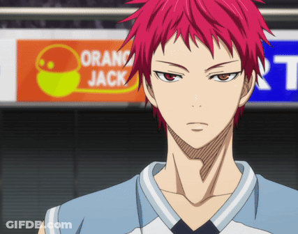 A Man With Red Hair Stands In Front Of A Sign That Says Orange Jack GIF