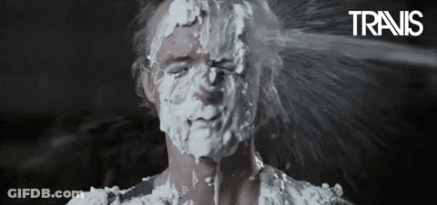 A Man With Shaving Cream On His Face And The Word Travis On The Bottom Right GIF