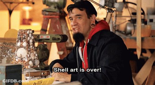 A Man With Shell Art Is Over Written On His Shirt GIF