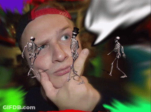 A Man With Skeletons In Front Of His Face And A Top Hat GIF